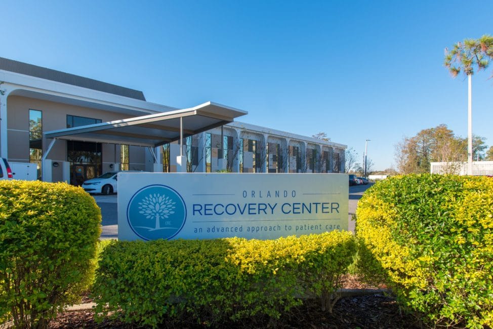 a building with a sign that says recovery center.